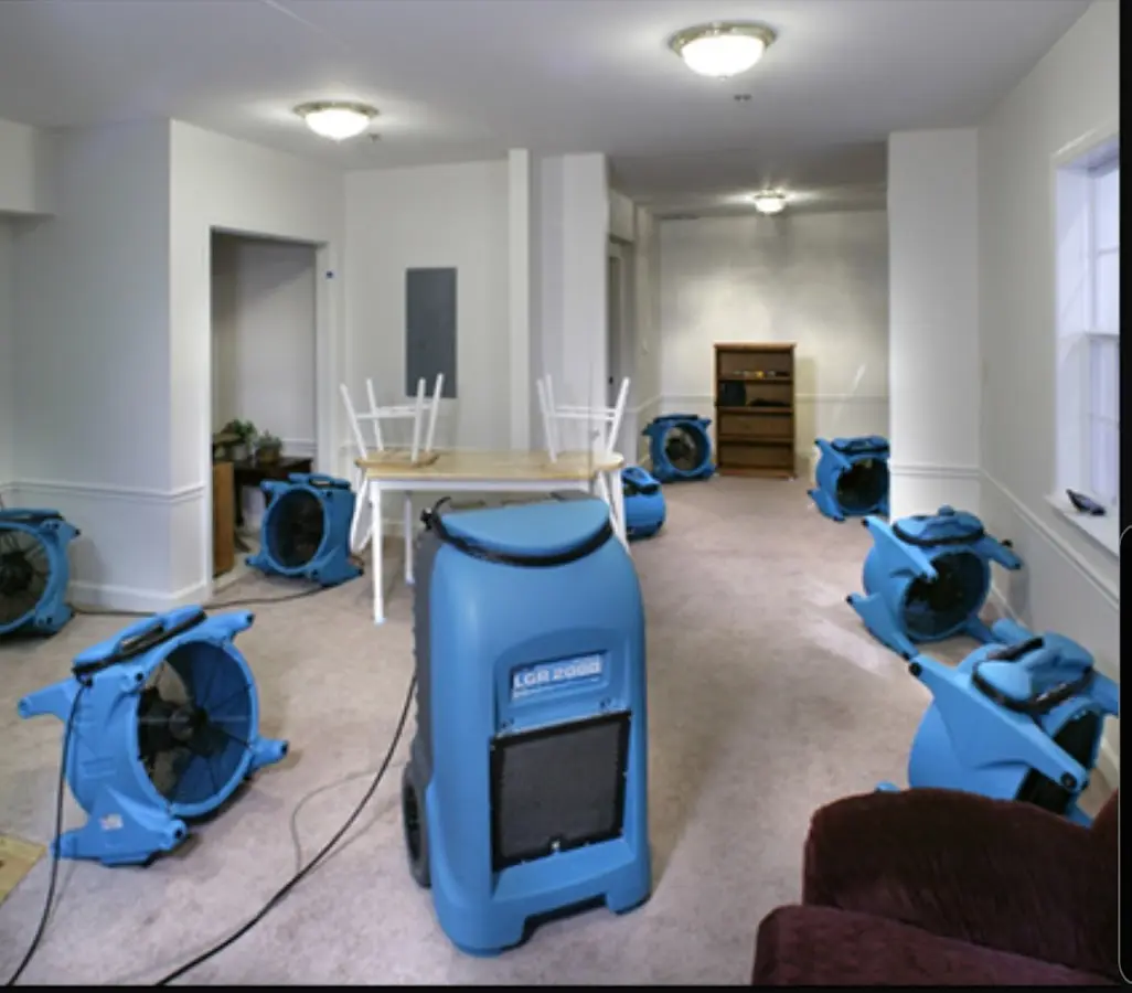 Air movers and dehumidifier setup for Water Damage Restoration in Wilmer